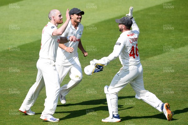 180525 - Glamorgan v Northamptonshire - Rothesay County Championship - James Harris of Glamorgan celebrates with team mates after he bowls the ball to dismiss Saif Zaib of Northamptonshire