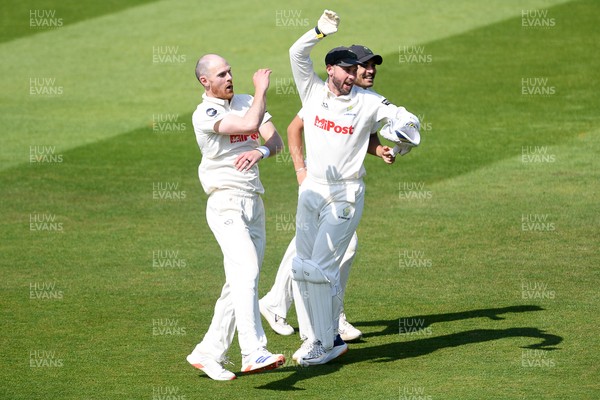 180525 - Glamorgan v Northamptonshire - Rothesay County Championship - James Harris of Glamorgan celebrates with team mates after he bowls the ball to dismiss Saif Zaib of Northamptonshire