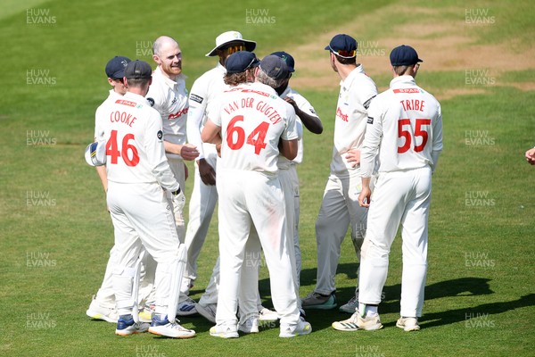 180525 - Glamorgan v Northamptonshire - Rothesay County Championship - James Harris of Glamorgan celebrates with team mates after he bowls the ball to dismiss Saif Zaib of Northamptonshire