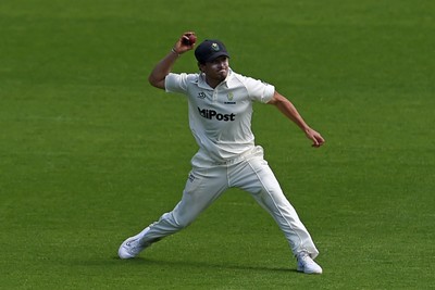 260624 - Glamorgan v Northamptonshire  - Vitality County Championship, Division 2 - Kiran Carlson of Glamorgan catches the ball