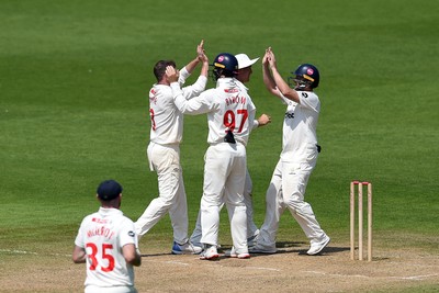 260624 - Glamorgan v Northamptonshire  - Vitality County Championship, Division 2 - Harry Podmore of glamorgan celebrates with teammates after taking the wicket of Justin Broad of Northamptonshire