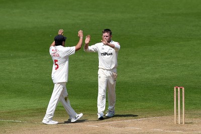 260624 - Glamorgan v Northamptonshire  - Vitality County Championship, Division 2 - Harry Podmore of glamorgan celebrates with teammates after taking the wicket of Justin Broad of Northamptonshire