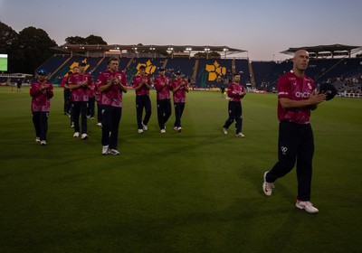 080726 - Glamorgan v Northamptonshire Steelbacks, Vitality Blast Men - The Steelbacks are led off the pitch by Chris Lynn after winning the match