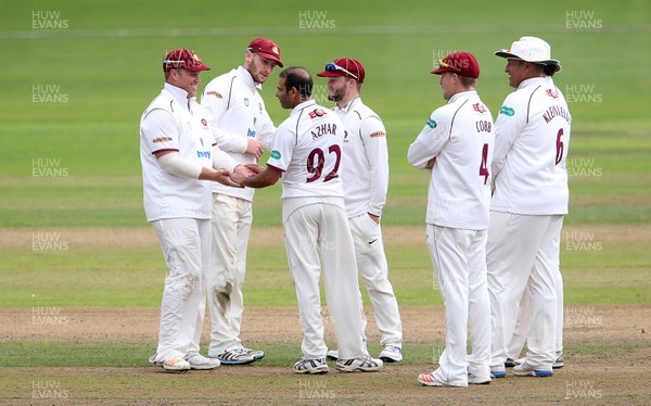 140917 - Glamorgan v Northamptonshire - Specsavers County Championship - Division Two - Azharullah of Northants celebrates with team mates celebrates bowling Kiran Carlson of Glamorgan