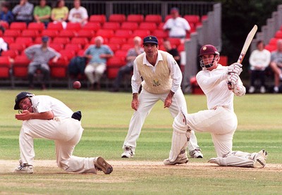 220897 - Glamorgan v Northants - David Ripley smashes the ball past Robert Croft as Steve James watches on