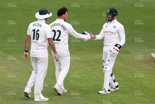 130722 - Glamorgan v Nottinghamshire - LV= County Championship Division Two - Liam Patterson-White and Joe Clarke of Nottinghamshire celebrate after taking the wicket of Colin Ingram of Glamorgan
