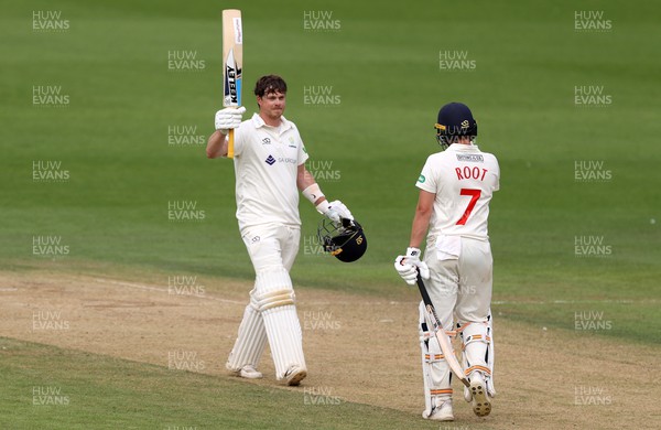 130722 - Glamorgan v Nottinghamshire - LV= County Championship Division Two - Sam Northeast of Glamorgan celebrates his century with Billy Root
