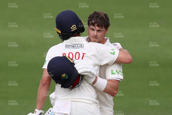 130722 - Glamorgan v Nottinghamshire - LV= County Championship Division Two - Sam Northeast of Glamorgan celebrates his century with Billy Root