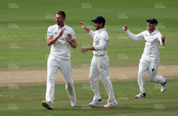130722 - Glamorgan v Nottinghamshire - LV= County Championship Division Two - Michael Hogan of Glamorgan celebrates with Andrew Salter as he bowls out Haseeb Hameed of Nottinghamshire
