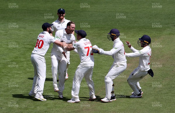 140722 - Glamorgan v Nottinghamshire - LV= County Championship Division Two - Colin Ingram of Glamorgan celebrates with team mates after bowling and catching Ben Slater of Nottinghamshire