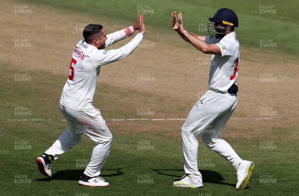 140722 - Glamorgan v Nottinghamshire - LV= County Championship Division Two - Kiran Carlson celebrates with Michael Neser of Glamorgan after Joe Clarke is caught by Chris Cooke