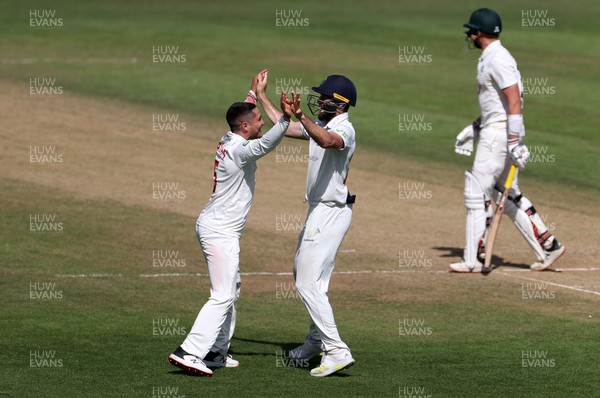140722 - Glamorgan v Nottinghamshire - LV= County Championship Division Two - Kiran Carlson celebrates with Michael Neser of Glamorgan after Joe Clarke is caught by Chris Cooke