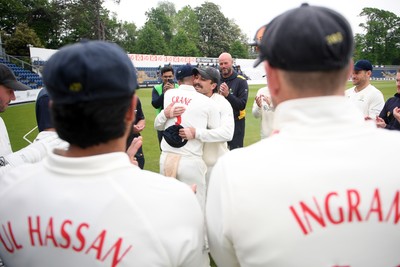 080526 - Glamorgan v Somerset - Rothesay County Championship -  Kiran Carlson of Glamorgan presents Mason Crane with a Glamorgan cap before the match