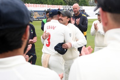 080526 - Glamorgan v Somerset - Rothesay County Championship -  Kiran Carlson of Glamorgan presents Mason Crane with a Glamorgan cap before the match