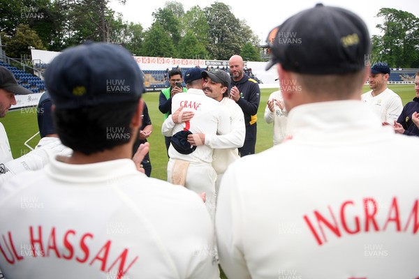 080526 - Glamorgan v Somerset - Rothesay County Championship -  Kiran Carlson of Glamorgan presents Mason Crane with a Glamorgan cap before the match