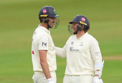110526 - Glamorgan v Somerset, Rothesay County Championship Division 1, Day 4 of 4 - Ryan Hadley of Glamorgan, left, with Timm van der Gugten of Glamorgan after he hits a six