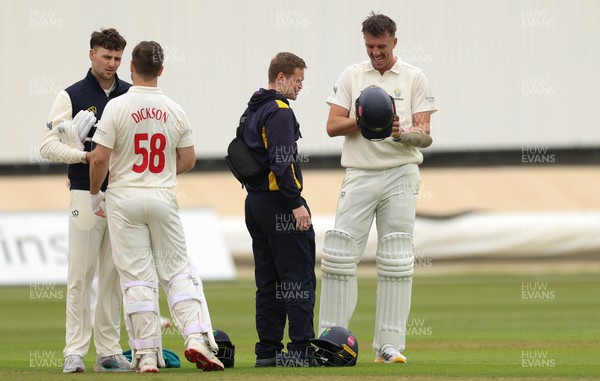 110526 - Glamorgan v Somerset, Rothesay County Championship Division 1, Day 4 of 4 - Ryan Hadley of Glamorgan is checked over after he takes a strike to the helmet