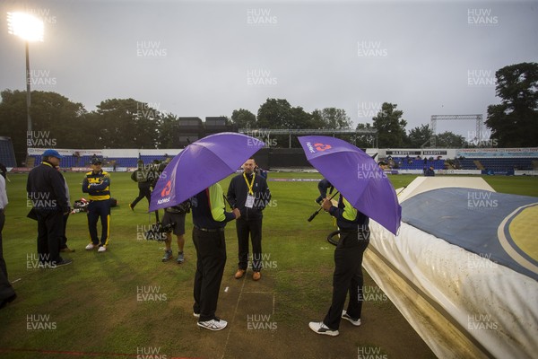 150717 - Glamorgan v Somerset - Natwest T20 Blast - The umpire's stand underneath their umbrella's