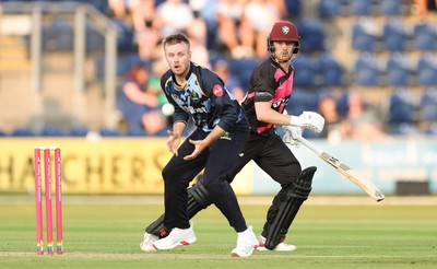 200625 - Glamorgan v Somerset, Vitality Blast  T20 - Mason Crane of Glamorgan and Tom Abell of Somerset keep their eyes on the ball