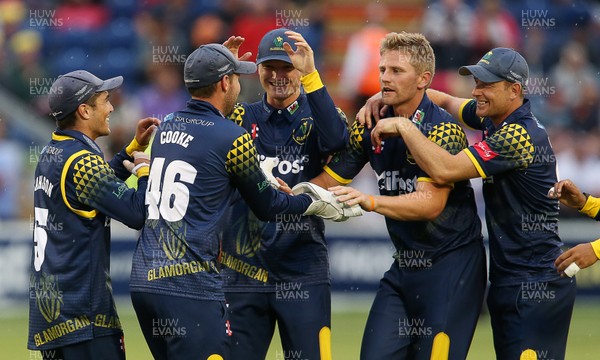200718 - Glamorgan v Somerset - Vitality Blast - Timm Van Der Gugten of Glamorgan celebrates with Chris Cooke and team mates after Tom Abell is caught