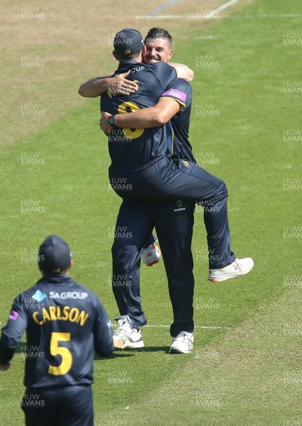 210419 - Glamorgan v Somerset, Royal London One Day Cup - Marchant de Lange of Glamorgan celebrates with Graham Wagg of Glamorgan after taking the wicket of Azhar Ali of Somerset