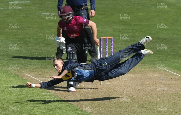 210419 - Glamorgan v Somerset, Royal London One Day Cup - Marnus Labuschagne of Glamorgan dives at full stretch to stop the ball off Craig Overton of Somerset's shot