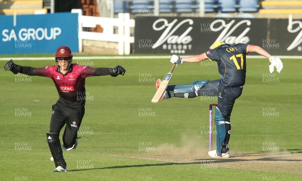 210419 - Glamorgan v Somerset, Royal London One Day Cup - Tom Banton of Somerset celebrates as Lukas Carey of Glamorgan reacts after he hits the ball only to be caught by Azhar Ali of Somerset giving Somerset victory