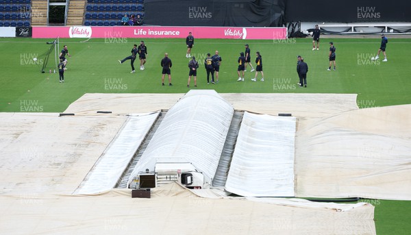 240622 - Glamorgan v Somerset, Vitality Blast T20 - Glamorgan players warm up in anticipation of play despite the covers remaining on