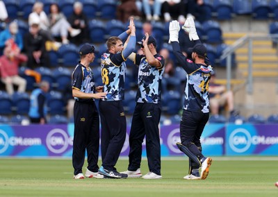 030625 - Glamorgan Cricket v Surrey - Vitality T20 Blast - Dan Douthwaite of Glamorgan celebrates after Ollie Pope was caught by Andy Gorvin