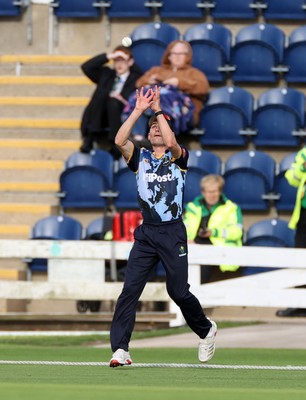 030625 - Glamorgan Cricket v Surrey - Vitality T20 Blast - Andy Gorvin of Glamorgan catches the ball to dismiss Dom Sibley