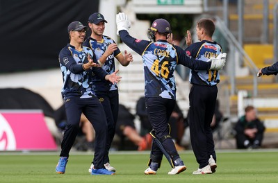 030625 - Glamorgan Cricket v Surrey - Vitality T20 Blast - Asa Tribe of Glamorgan celebrates the wicket Sam Curran off the bowling of Andy Gorvin