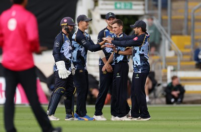 030625 - Glamorgan Cricket v Surrey - Vitality T20 Blast - Asa Tribe of Glamorgan celebrates the wicket Sam Curran off the bowling of Andy Gorvin