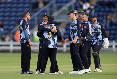 030625 - Glamorgan Cricket v Surrey - Vitality T20 Blast - Kiran Carlson of Glamorgan celebrates with team mates after catches the ball to dismiss Ollie Sykes of Surrey