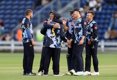 030625 - Glamorgan Cricket v Surrey - Vitality T20 Blast - Kiran Carlson of Glamorgan celebrates with team mates after catches the ball to dismiss Ollie Sykes of Surrey