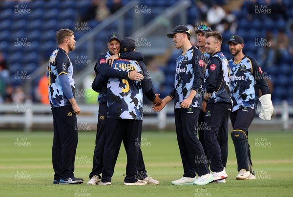 030625 - Glamorgan Cricket v Surrey - Vitality T20 Blast - Kiran Carlson of Glamorgan celebrates with team mates after catches the ball to dismiss Ollie Sykes of Surrey