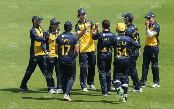 030821 - Glamorgan v Surrey, Royal London One Day Cup - Nick Selman of Glamorgan is congratulated after he catches Tim David of Surrey off the bowling of Andrew Salter