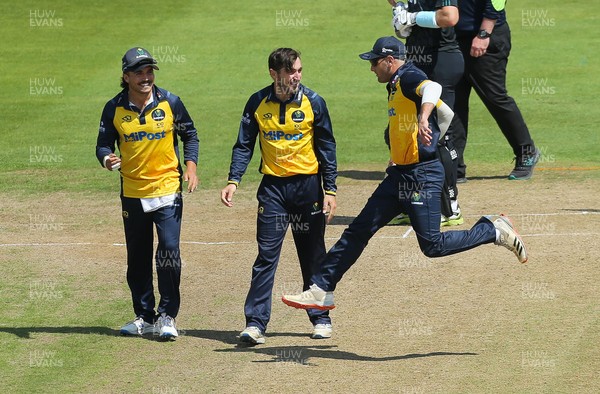 030821 - Glamorgan v Surrey, Royal London One Day Cup -Andrew Salter of Glamorgan is congratulated after taking the wicket of Nick Kimber of Surrey
