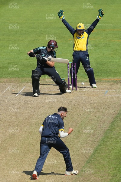 030821 - Glamorgan v Surrey, Royal London One Day Cup - Daniel Moriarty of Surrey is bowled by Steven Reinhold of Glamorgan as Tom Cullen of Glamorgan looks on