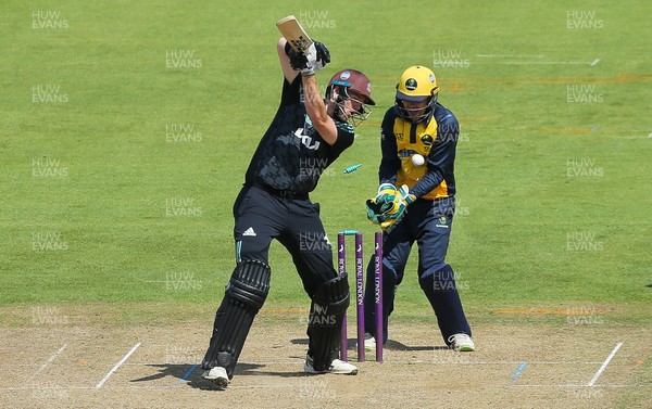 030821 - Glamorgan v Surrey, Royal London One Day Cup - Daniel Moriarty of Surrey is bowled by Steven Reinhold of Glamorgan as Tom Cullen of Glamorgan looks on