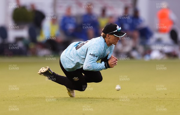 070623 - Glamorgan v Surrey, Vitality Blast T20 - Tom Curran of Surrey drops the ball as he looks to catch Billy Root of Glamorgan