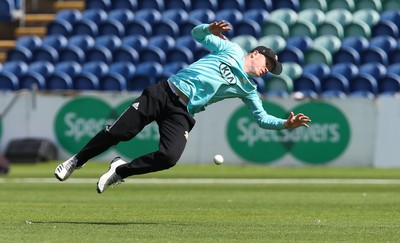 110819 - Glamorgan v Surrey, Vitality Blast - Ollie Pope of Surrey fails to hold a catch after diving to take Colin Ingram of Glamorgan