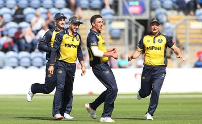 110819 - Glamorgan v Surrey, Vitality Blast - Ruaidhri Smith of Glamorgan celebrates taking the wicket of Aaron Finch of Surrey as he is caught by Chris Cooke of Glamorgan