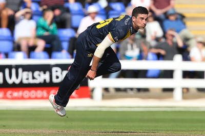 110819 - Glamorgan v Surrey, Vitality Blast - Ruaidhri Smith of Glamorgan bowls