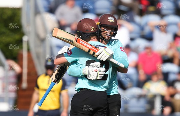 110819 - Glamorgan v Surrey, Vitality Blast - Ollie Pope of Surrey and Ben Foakes of Surrey congratulate each other at the end of the match