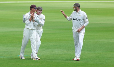 190626 - Glamorgan v Surrey, Rothesay County Championship Division 1- Adam Thomas of Surrey celebrates after he catches Sean Dickson of Glamorgan of the bowling of Jordan Clark of Surrey