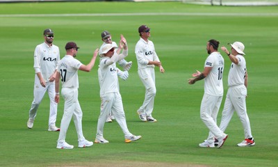 190626 - Glamorgan v Surrey, Rothesay County Championship Division 1- Adam Thomas of Surrey celebrates after he catches Sean Dickson of Glamorgan of the bowling of Jordan Clark of Surrey