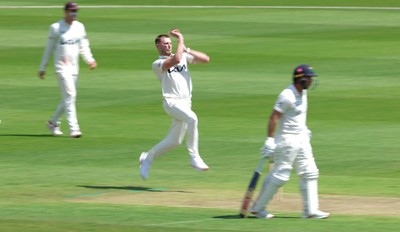 190626 - Glamorgan v Surrey, Rothesay County Championship Division 1- Gus Atkinson of Surrey bowls