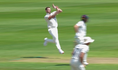 190626 - Glamorgan v Surrey, Rothesay County Championship Division 1- Gus Atkinson of Surrey bowls