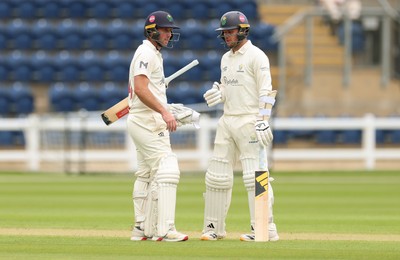 190626 - Glamorgan v Surrey, Rothesay County Championship Division 1- Chris Cooke of Glamorgan and Mason Crane of Glamorgan chat during a change of overs
