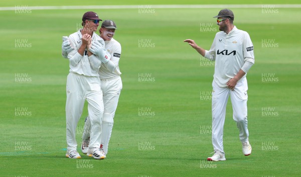 190626 - Glamorgan v Surrey, Rothesay County Championship Division 1- Adam Thomas of Surrey celebrates after he catches Sean Dickson of Glamorgan of the bowling of Jordan Clark of Surrey